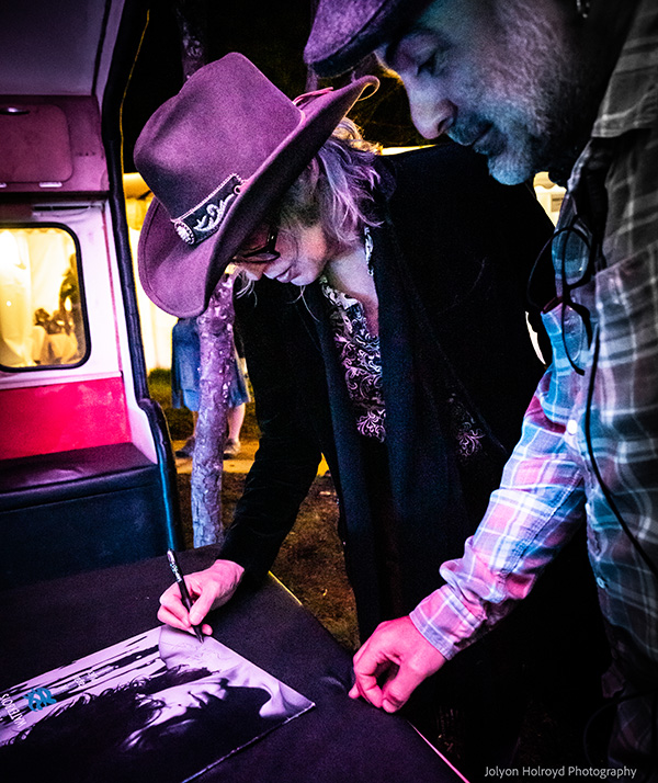 Mike signing an autograph